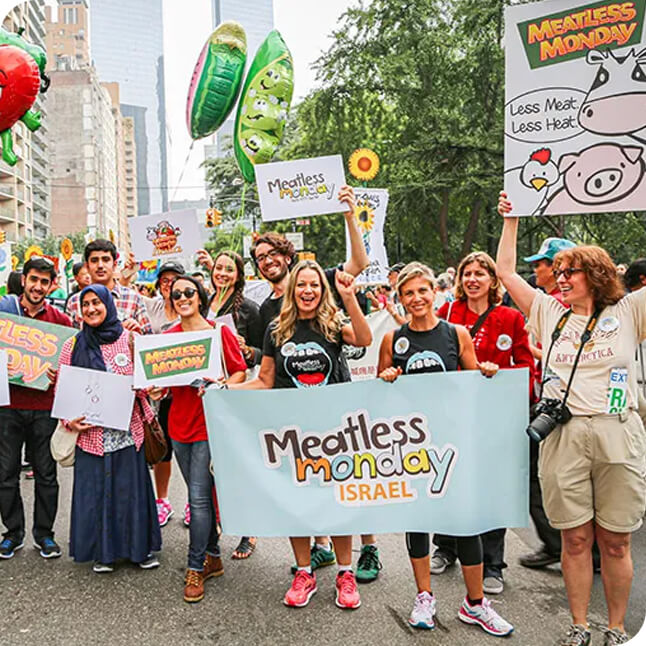meatless-moday-tinify Meatless Monday supporters participating in a public awareness event